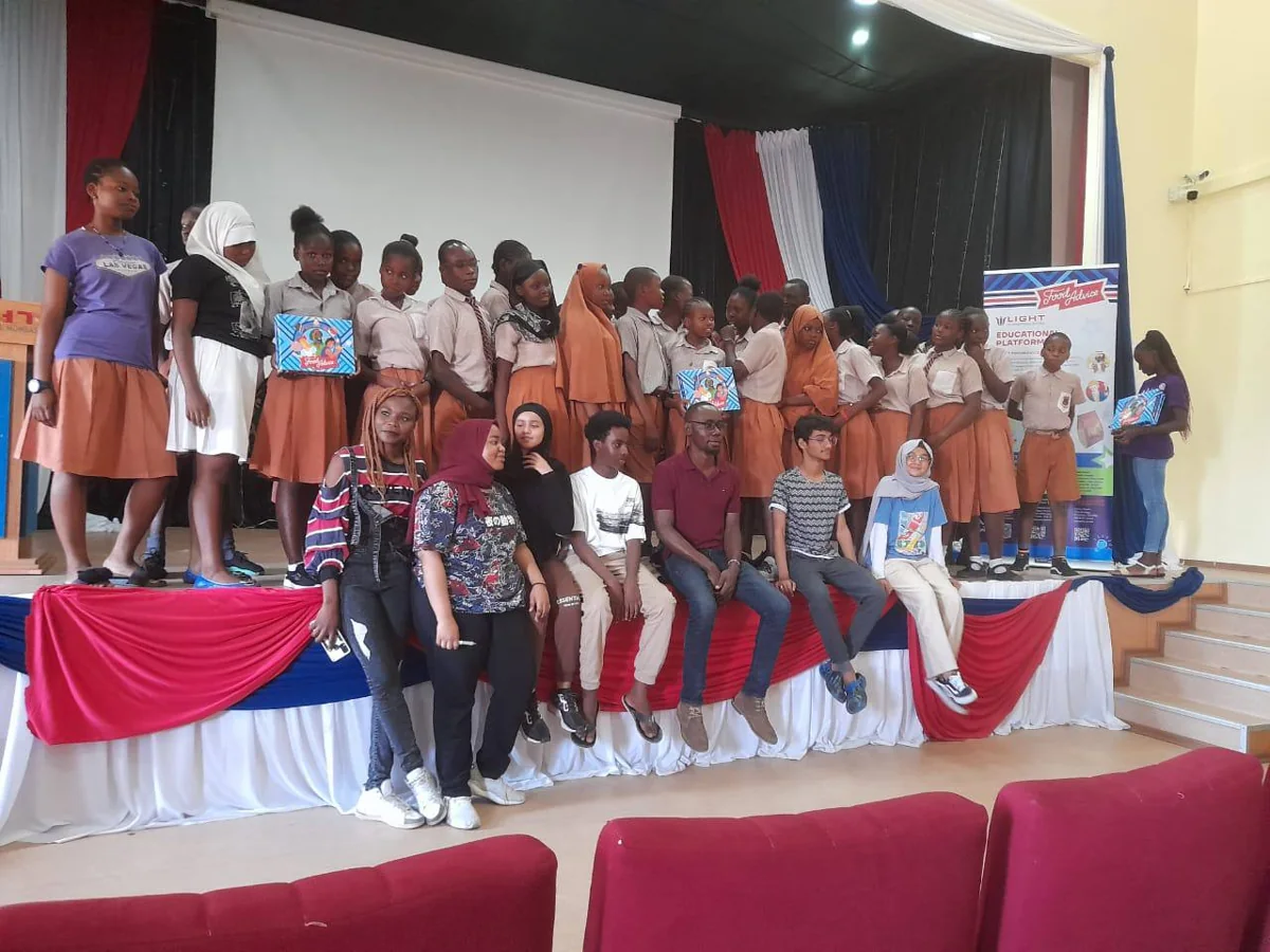 Students and facilitators together on stage