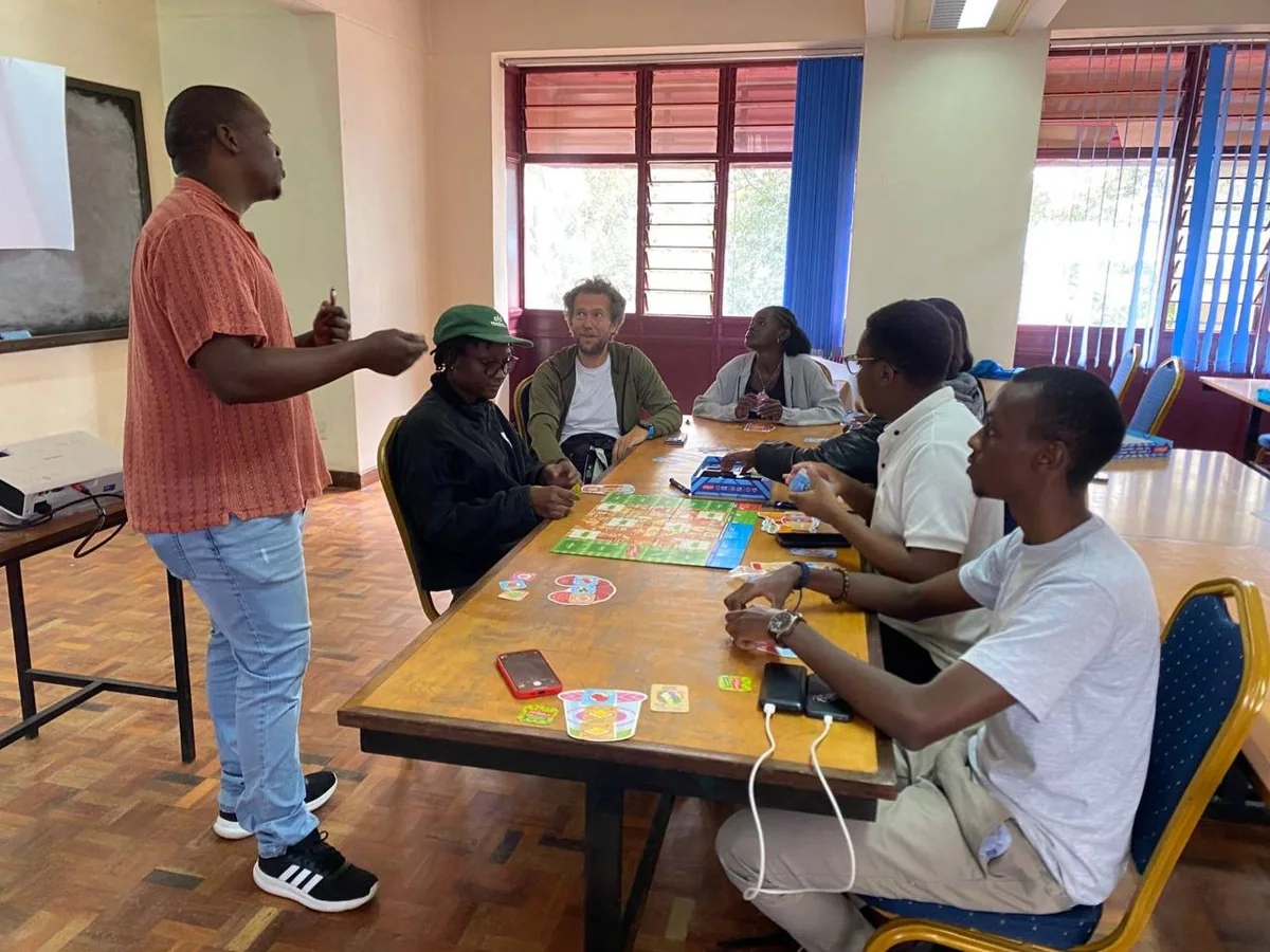Facilitator and participants discussing a learning activity
