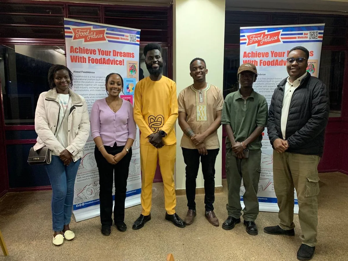 Participants beside FoodAdvice programme banners